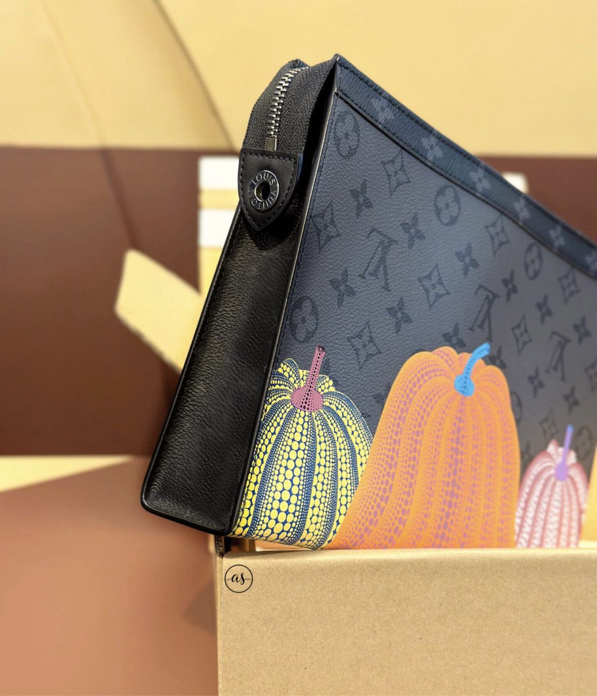 Louis Vuitton Unisex Reverse Pochette Designer handbag with pumpkin design on a box