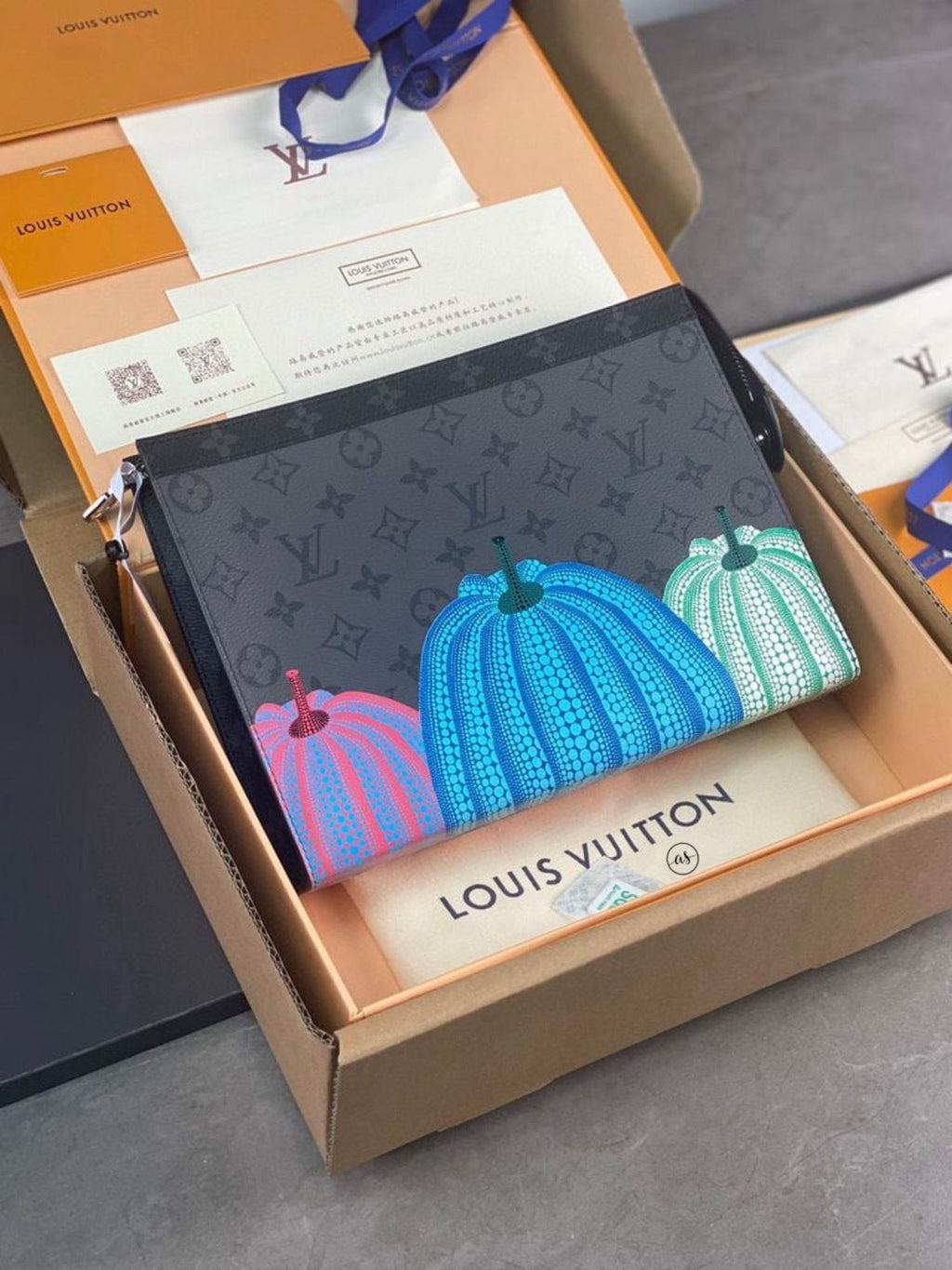 Louis Vuitton Unisex Reverse Pochette Louis Vuitton pouch with colorful pumpkin design in a box