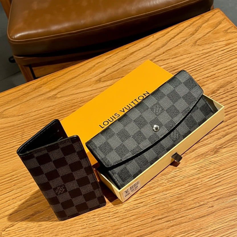 Black Louis Vuitton wallet on a wooden surface with packaging