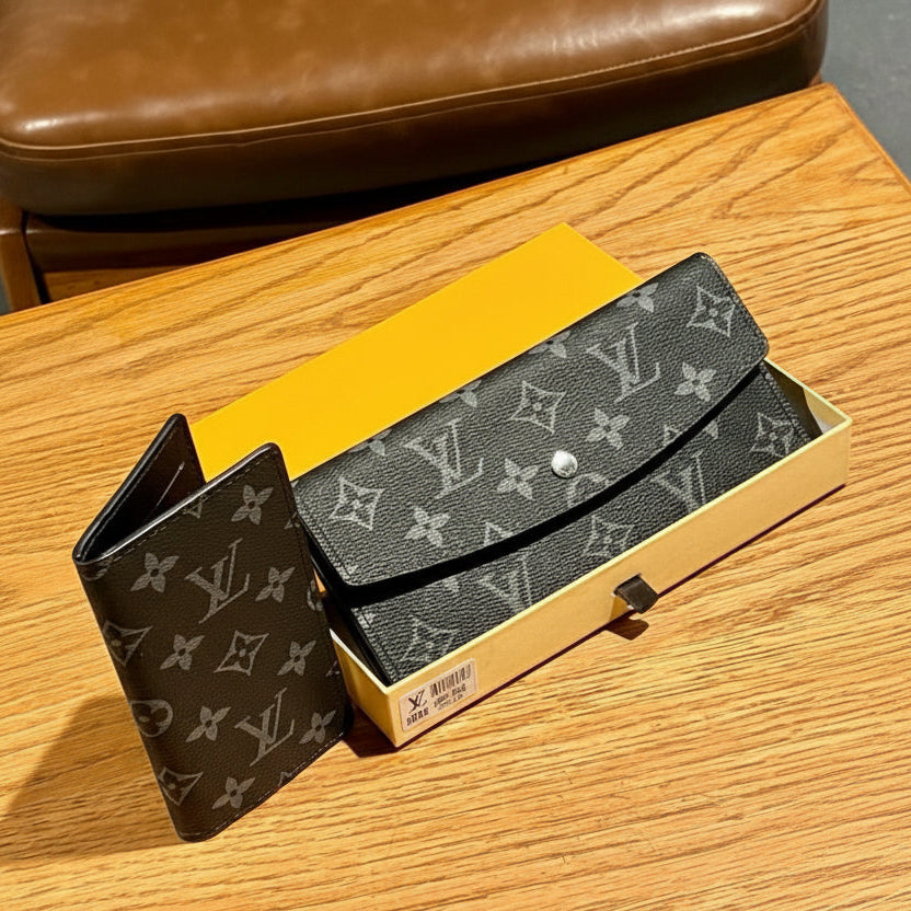Black Louis Vuitton Wallet Louis Vuitton wallet on a wooden surface with a yellow box