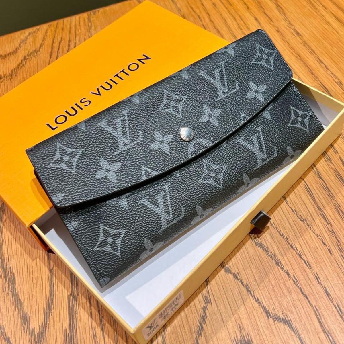 Blue Louis Vuitton Wallet Louis Vuitton wallet in a box on a wooden surface